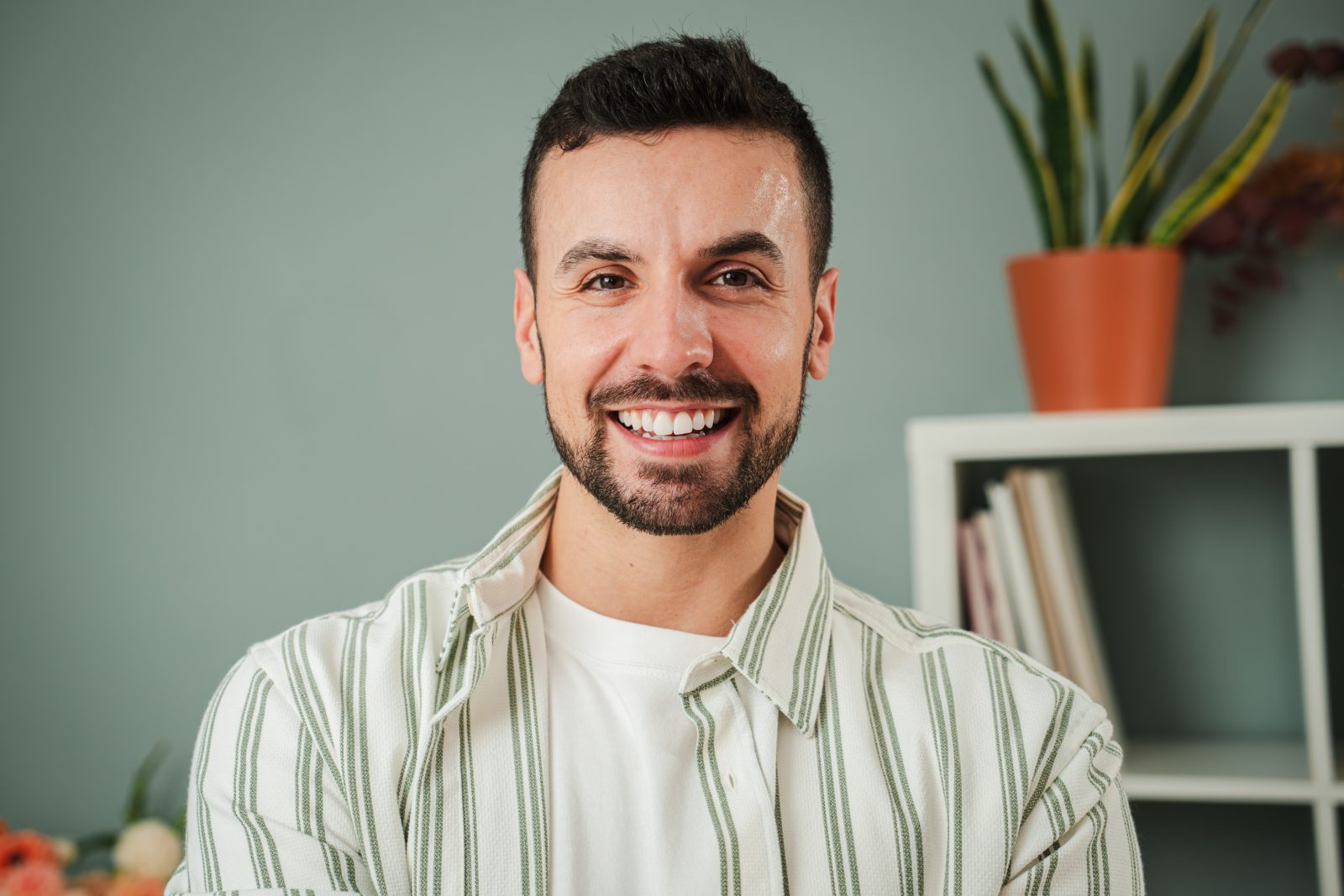 Smiling man at home – online psychiatry in Oakland, CA